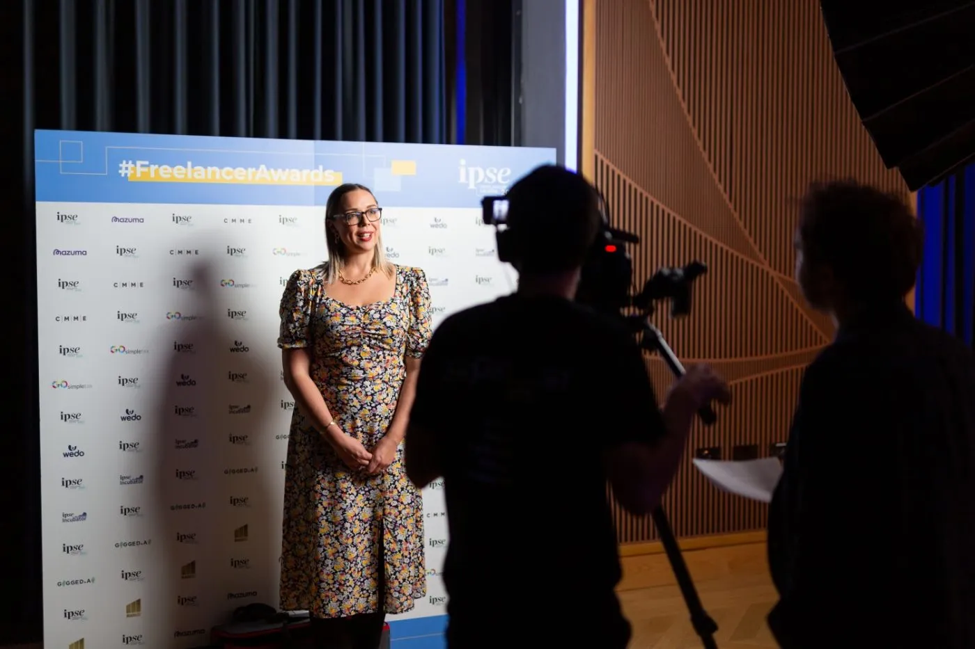 cameraman-filming-woman
