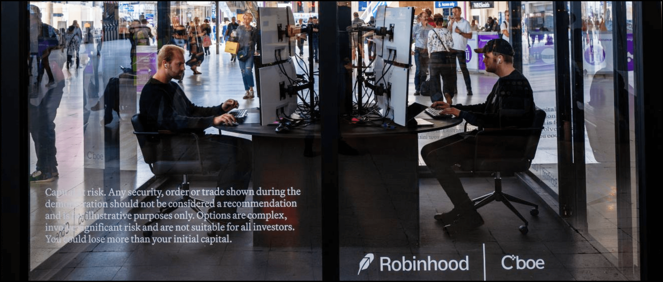 brand activation robinhood image. Two live traders inside a booth for the legend platform launch