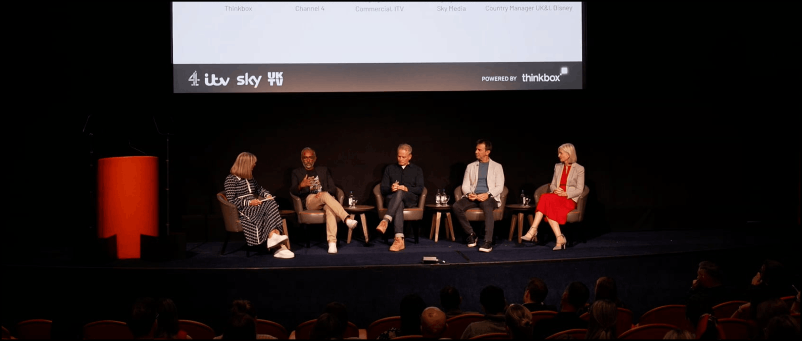 A stage of speakers from thinkbox present a live streamed event